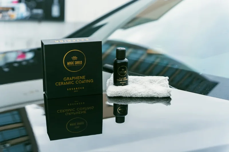 Magic Shield Graphene Ceramic Coating on a reflective black vehicle hood