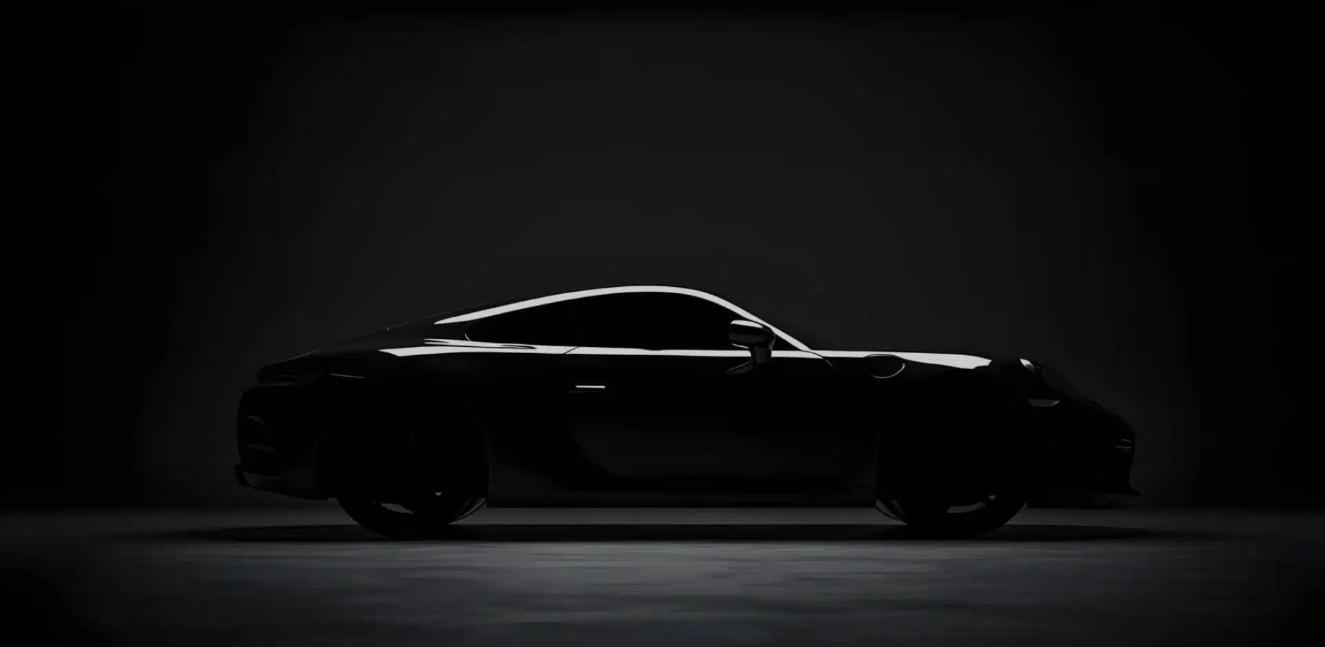 Glossy black performance car under premium studio lighting